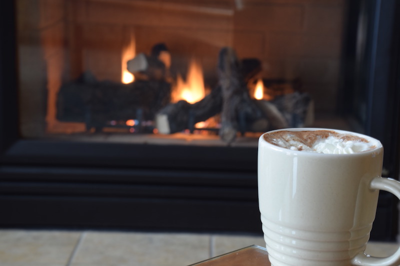 angelica king hot cocoa in front of the fireplace two harbors